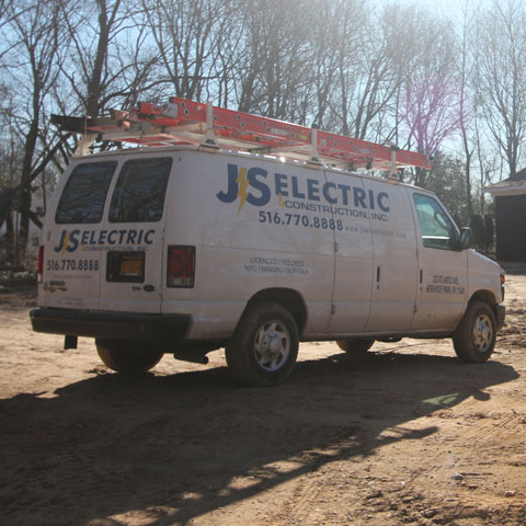JS Electric branded service van on a job site on Long Island